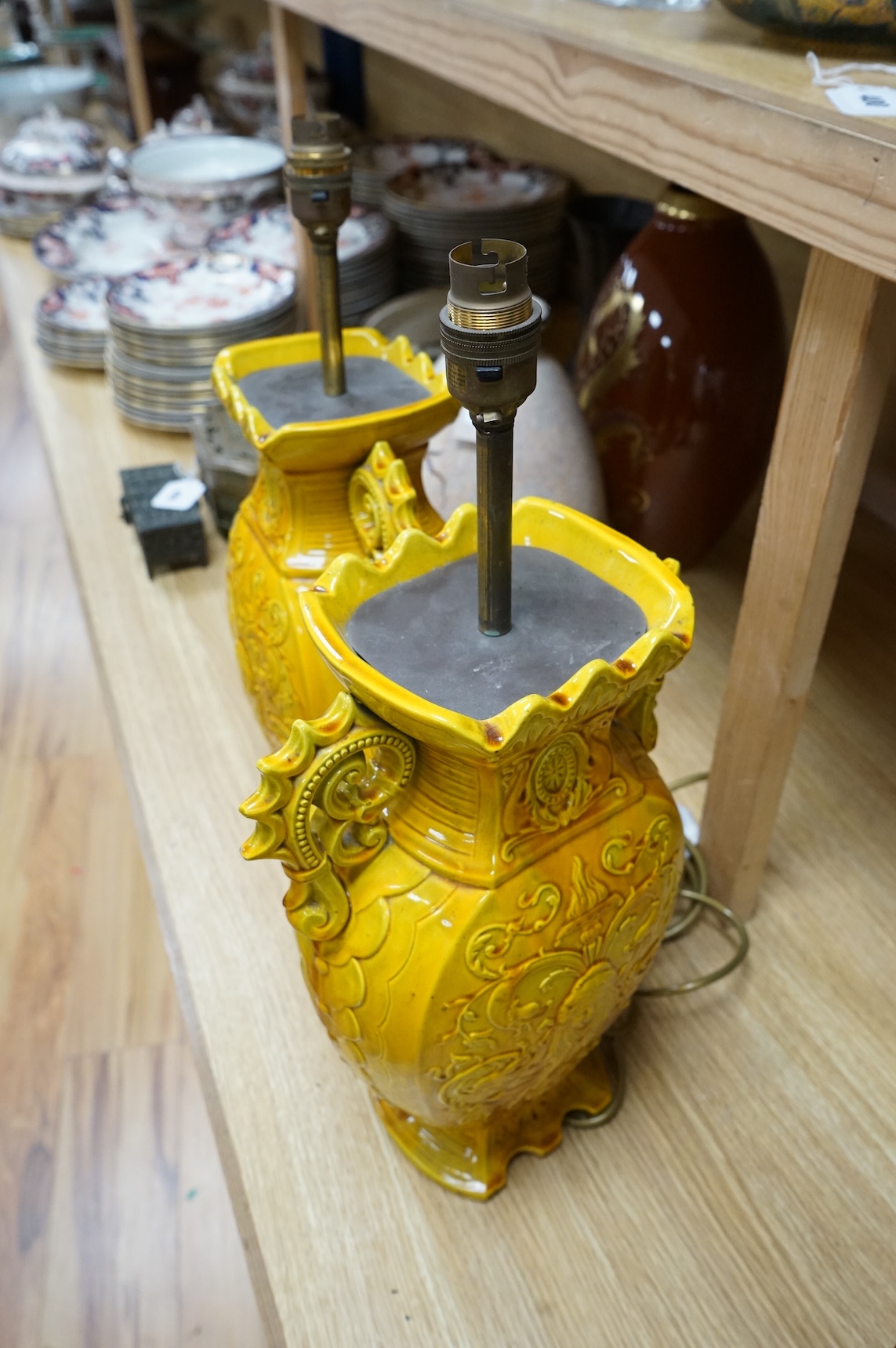 A pair of late 19th century Majolica yellow glazed vases, mounted as table lamps, marked ‘W & Co’ to base, 47cm total